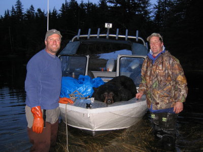 Shanna's Bear riding in the bow of the boat